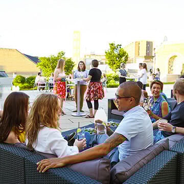 People enjoying drink on the rooftop
