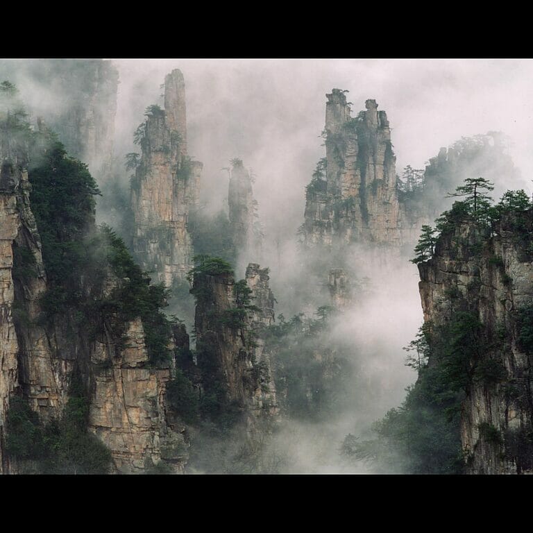 A landscape of mountains in the clouds