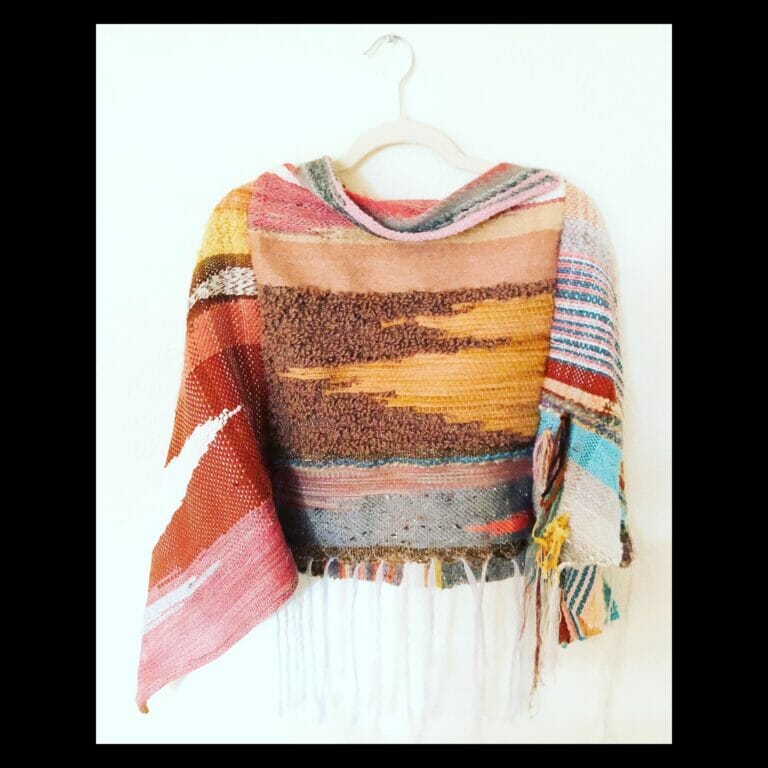 A knit shawl with warmtones