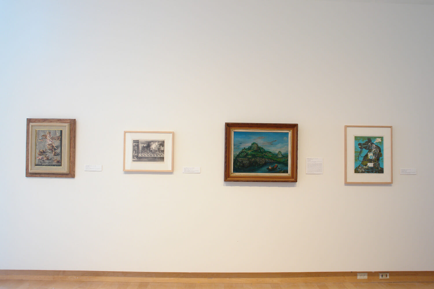 installation view of "the mystery beneath" showing framed artworks on the wall