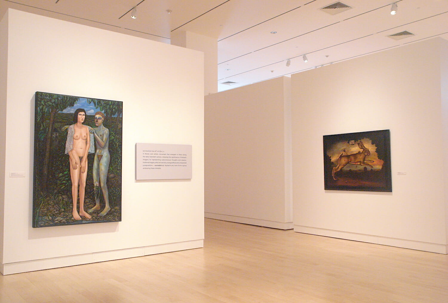 installation view of "In Depth," featuring two framed paintings on two different walls
