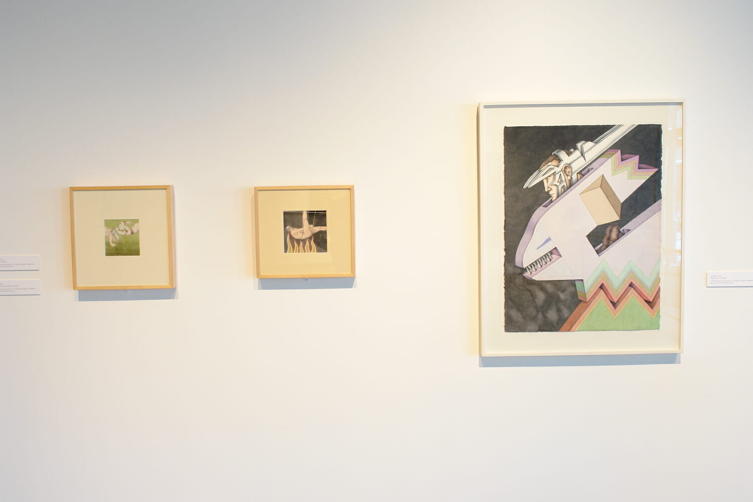 installation view of "The Singing Bird Rooms of Robert Lostutter" with framed artworks hanging across the wall