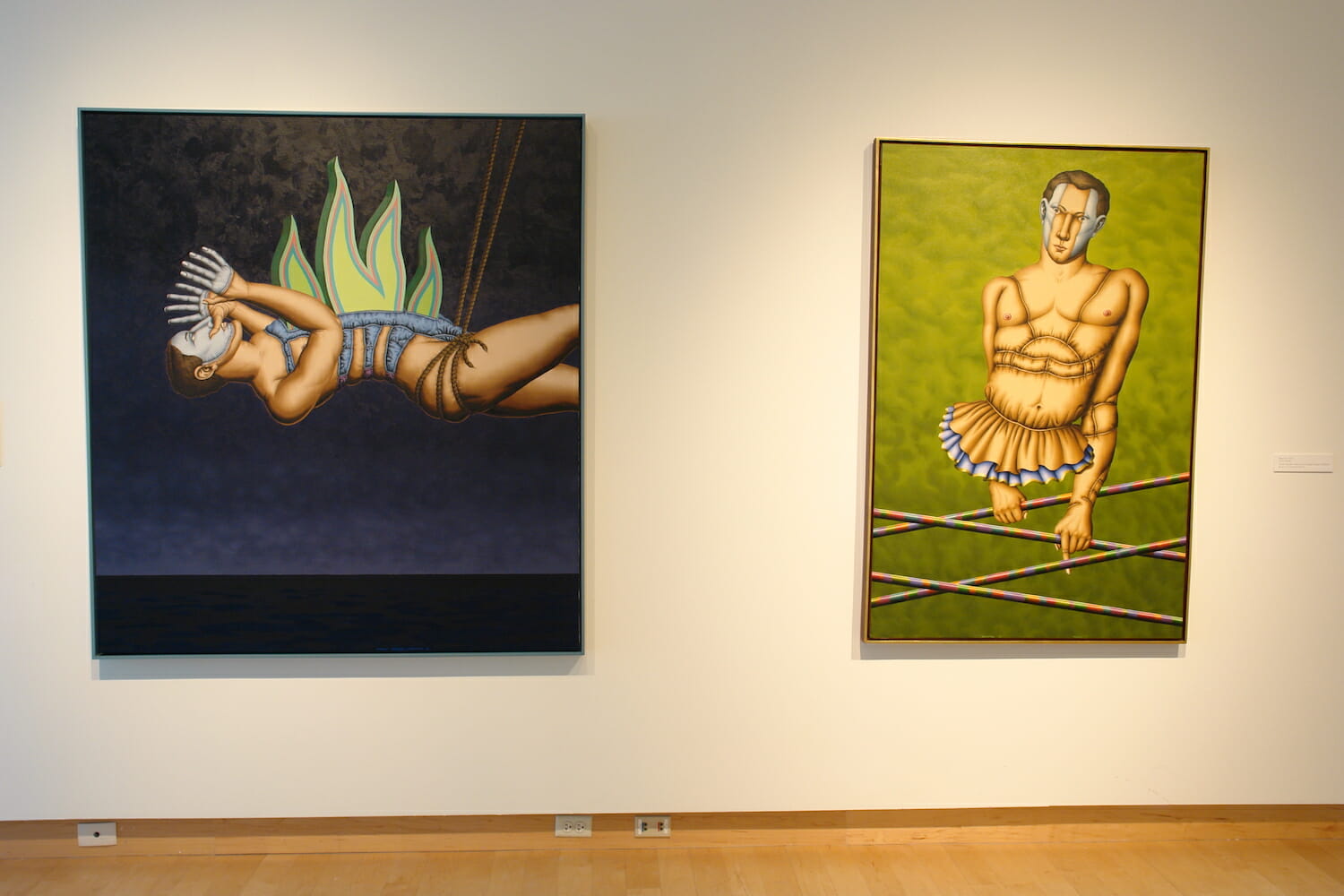 installation view of "The Singing Bird Rooms of Robert Lostutter" with two large artworks hanging side-by-side on the wall, featuring human-like creatures