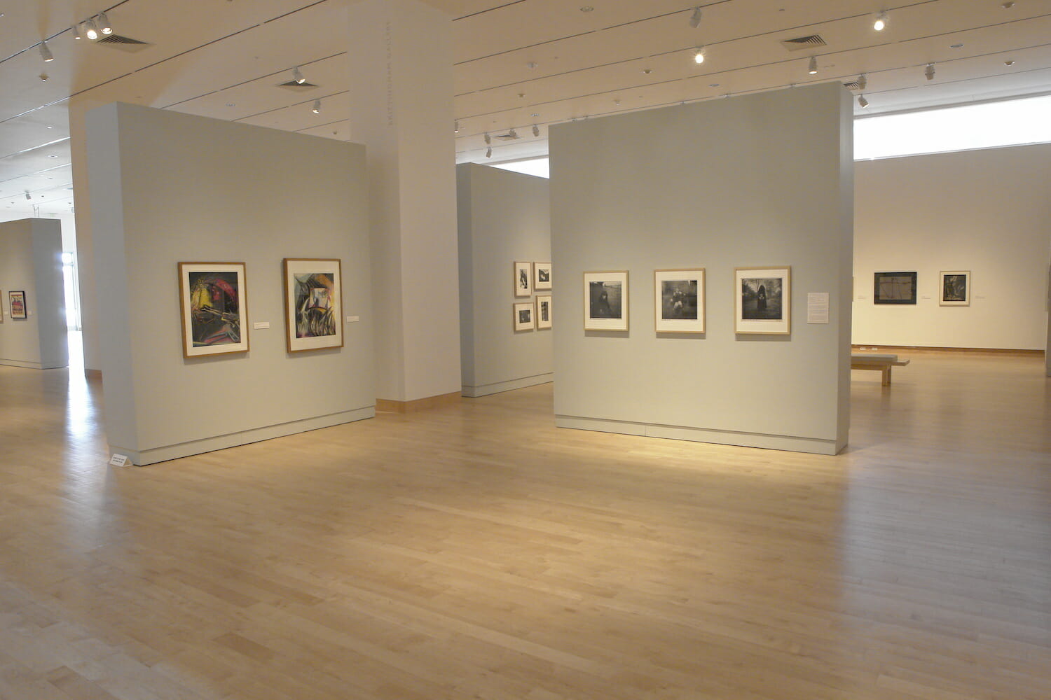 installation view of "Something Wicked This Way Comes" showing framed artworks hanging on the wall