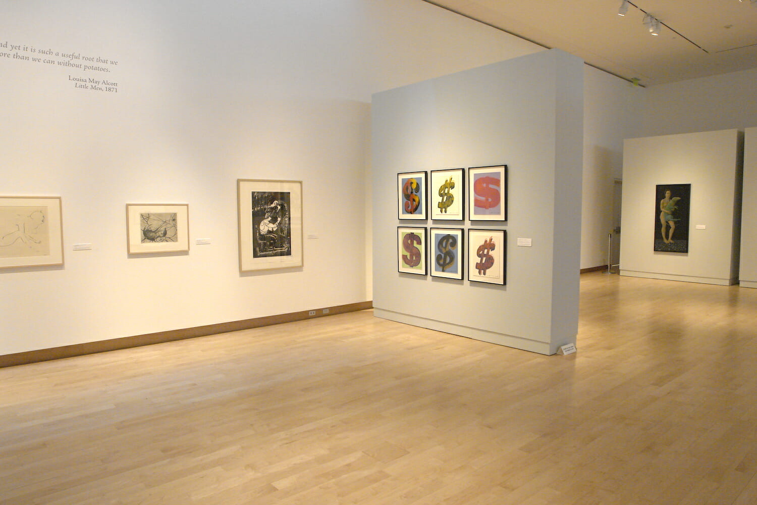 installation view of "Something Wicked This Way Comes" showing framed artworks hanging on the wall