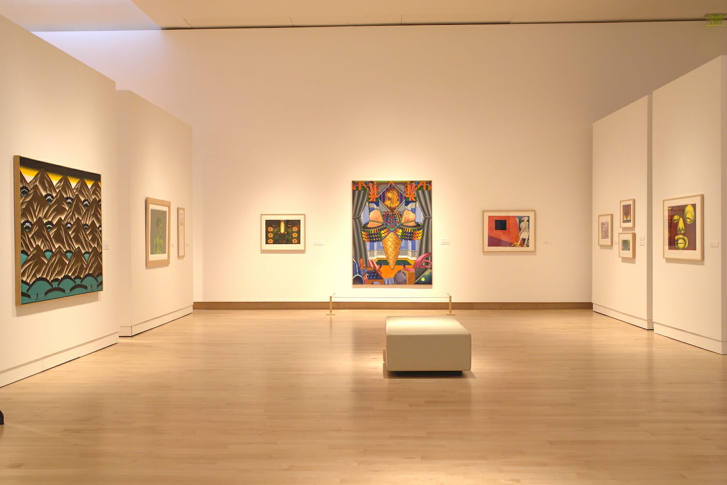 installation view of "Hairy Who" featuring various artworks hanging on the wall, surrounding the room
