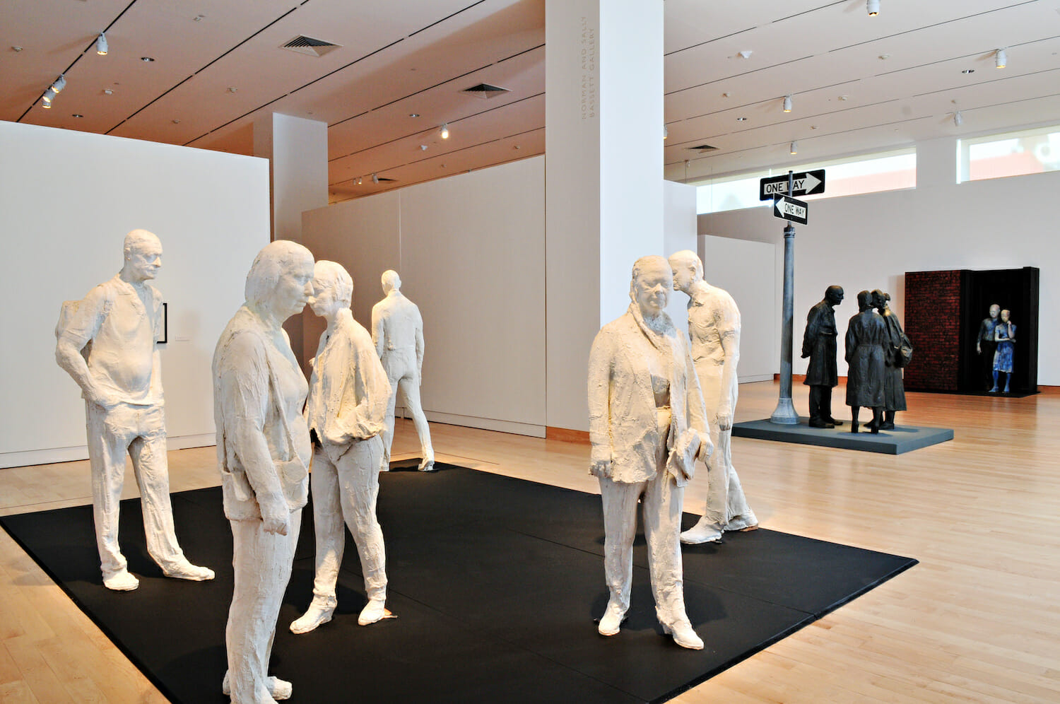 gallery installation view of George Segal: Street Scenes, featuring a variety of sculptures featuring people gathered together