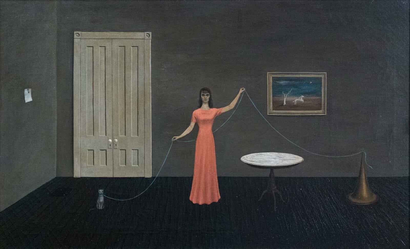 A woman in a room with a cat