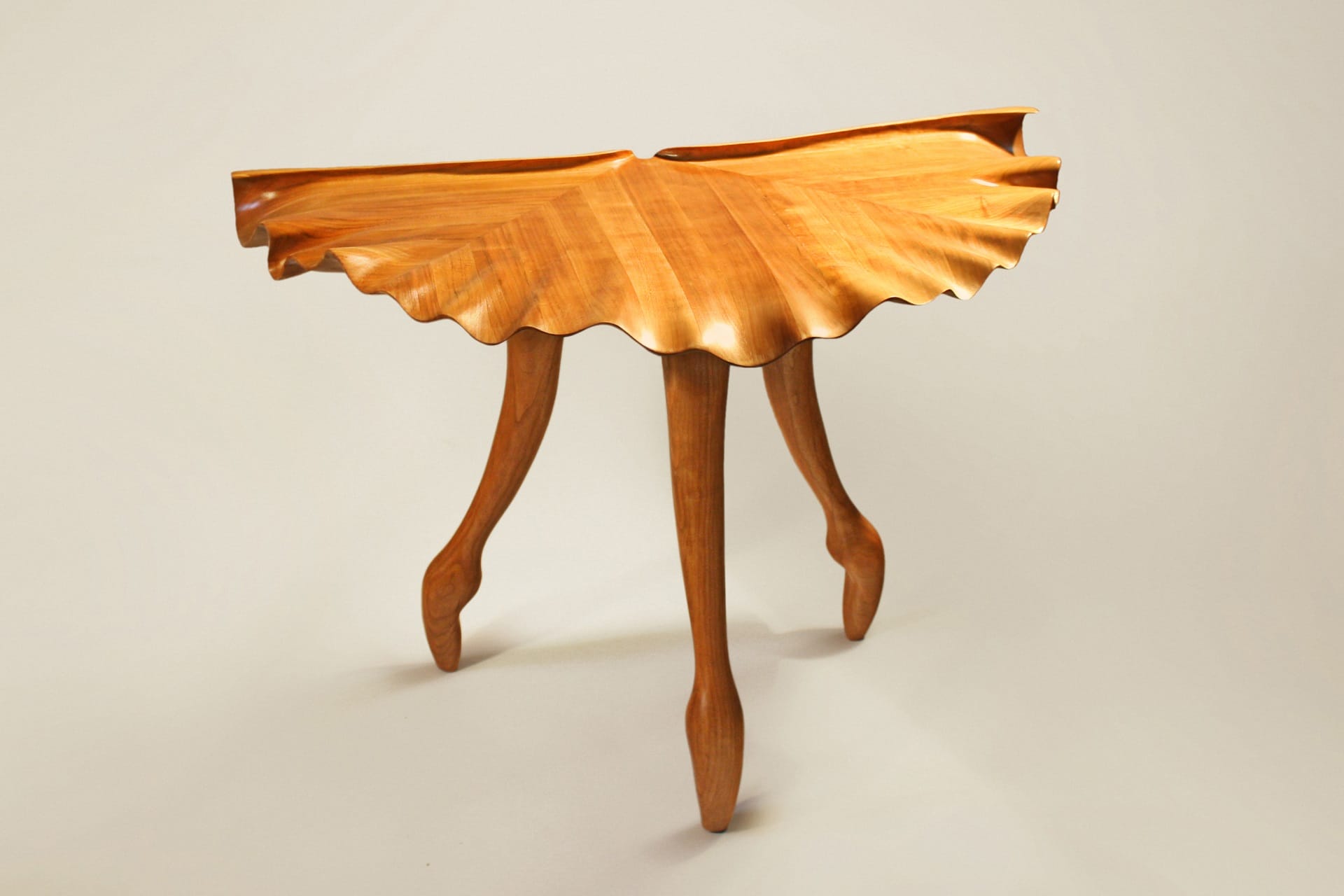 Wood table reminiscent of ballet on point and tutu