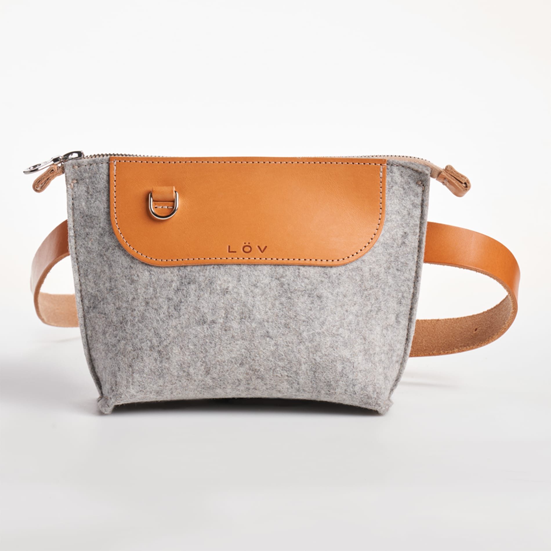 a wool and leather handbag against a white background.