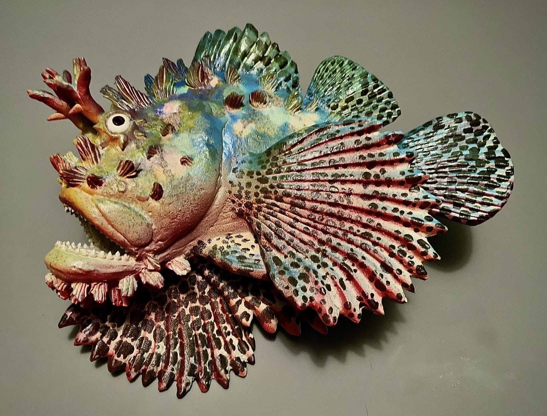 A multi colored ceramic fish.