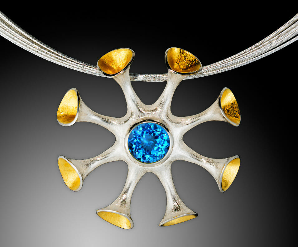 Necklace with an abstract octopus-like pendant.