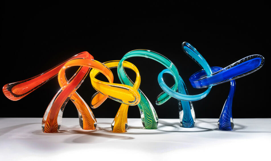 Handblown glass art with curving shapes