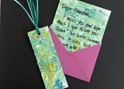 Painted paper and bookmark with marbled design.
