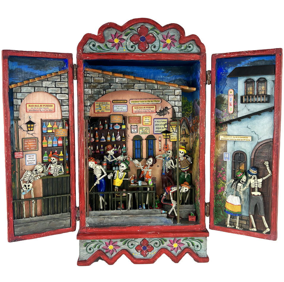 3D mixed media box with two swing doors. Inside is a sculpted scene of skeletons at a bar or restaurant.