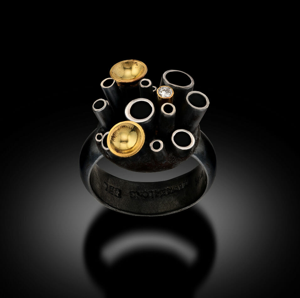 Handmade ring with cylindrical projections.