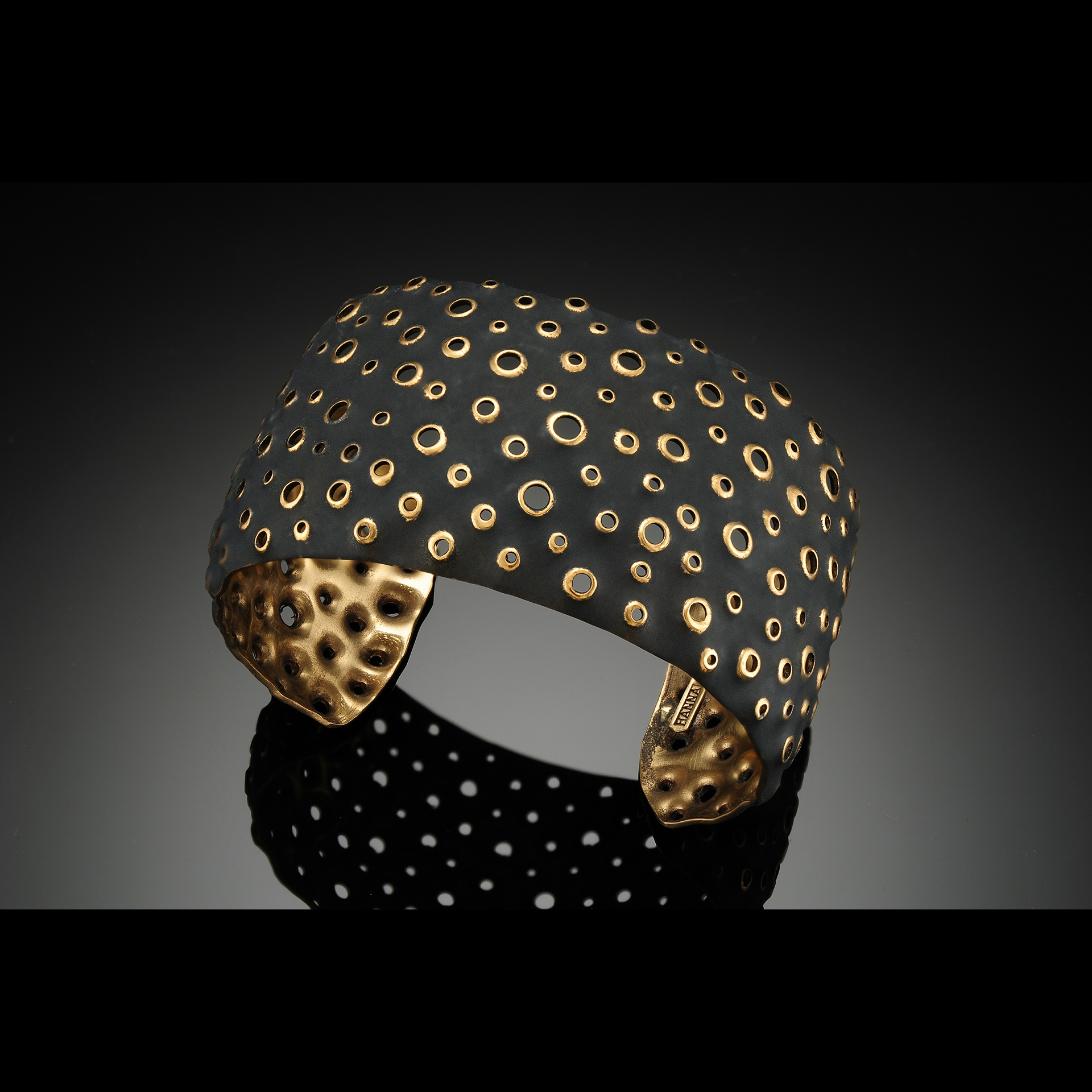 A bracelet with many holes in it.
