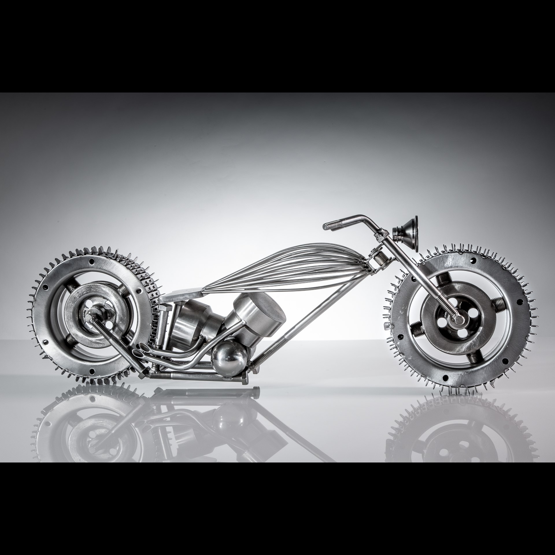 A metal model of a motorcycle.