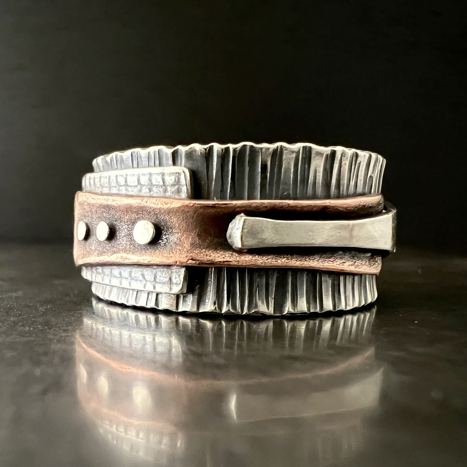 A metal and leather band.