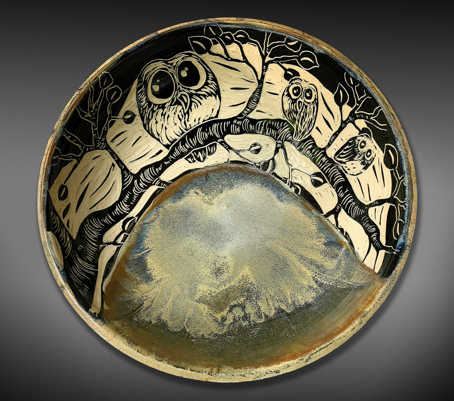 Ceramic bowl with a design featuring owls on a tree branch.