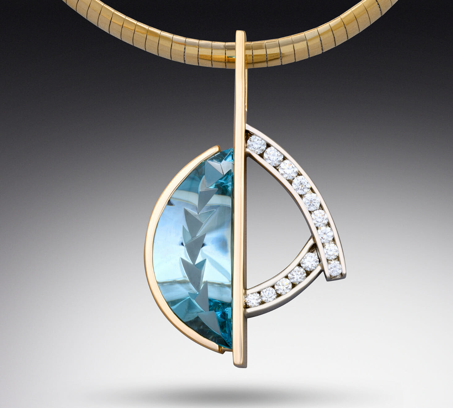 Close up of a pendant with multiple diamonds on a thick gold chain.