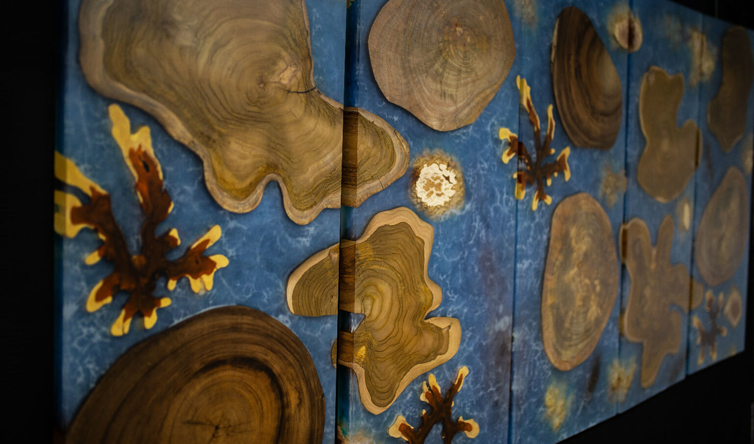 Wood and epoxy art blended to create a piece that looks like islands floating in the sea.