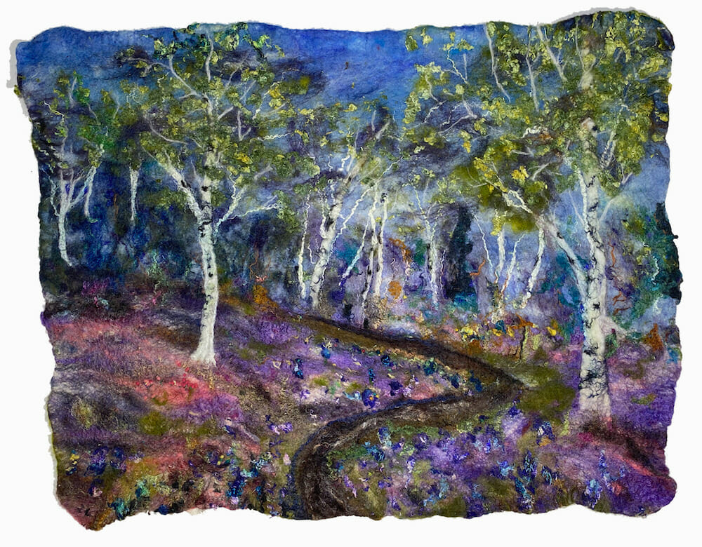 Fiber felt art depicting a forest.