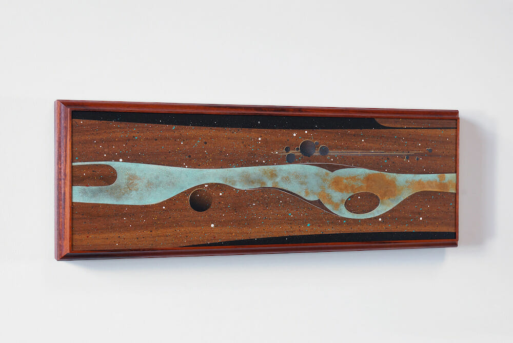 Artwork using polymer, granite, and iron pigment on wood. The work is handpainted, airbrushed, and relief carved to reveal intricate sublayers.