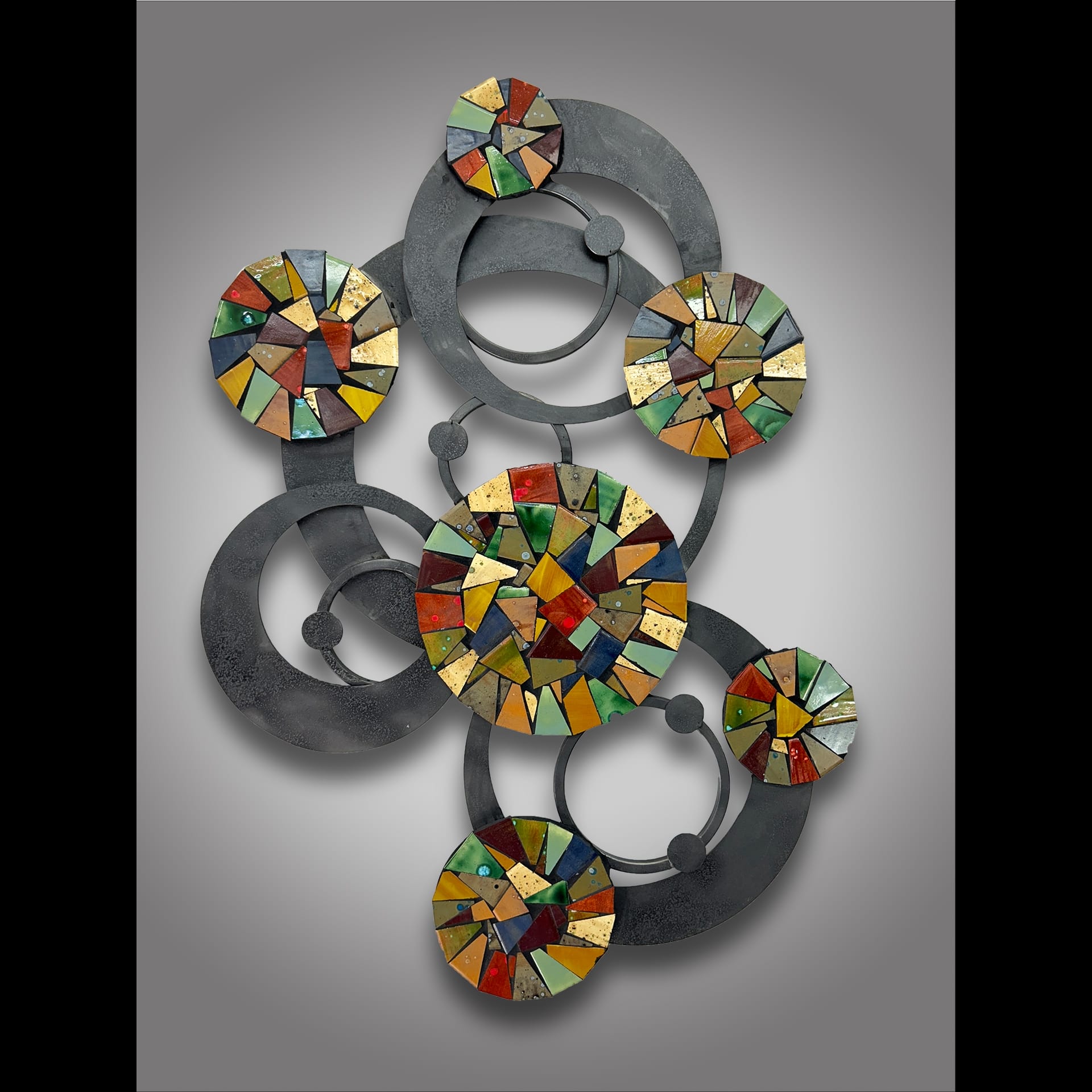 A metal structure made up of circles and colorful shapes.