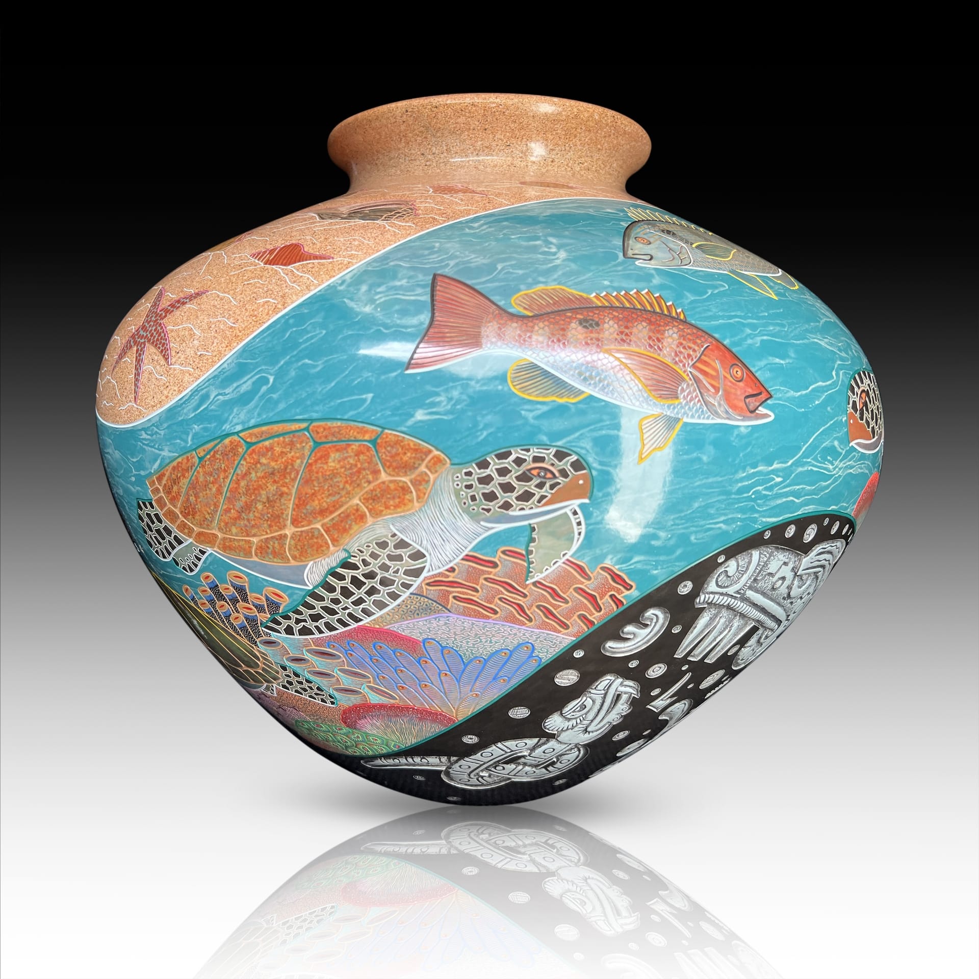 A vase with sea turtles and other underwater life painted on it.