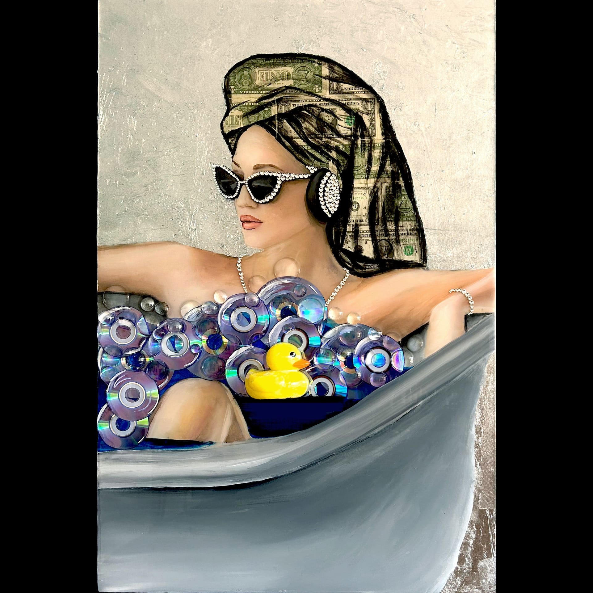 A woman in a bathtub with a towel on her head and a rubber duckie.