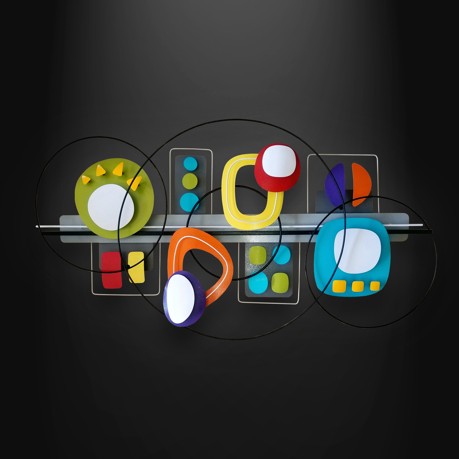 Abstract colorful shapes arranged decoratively along wire.