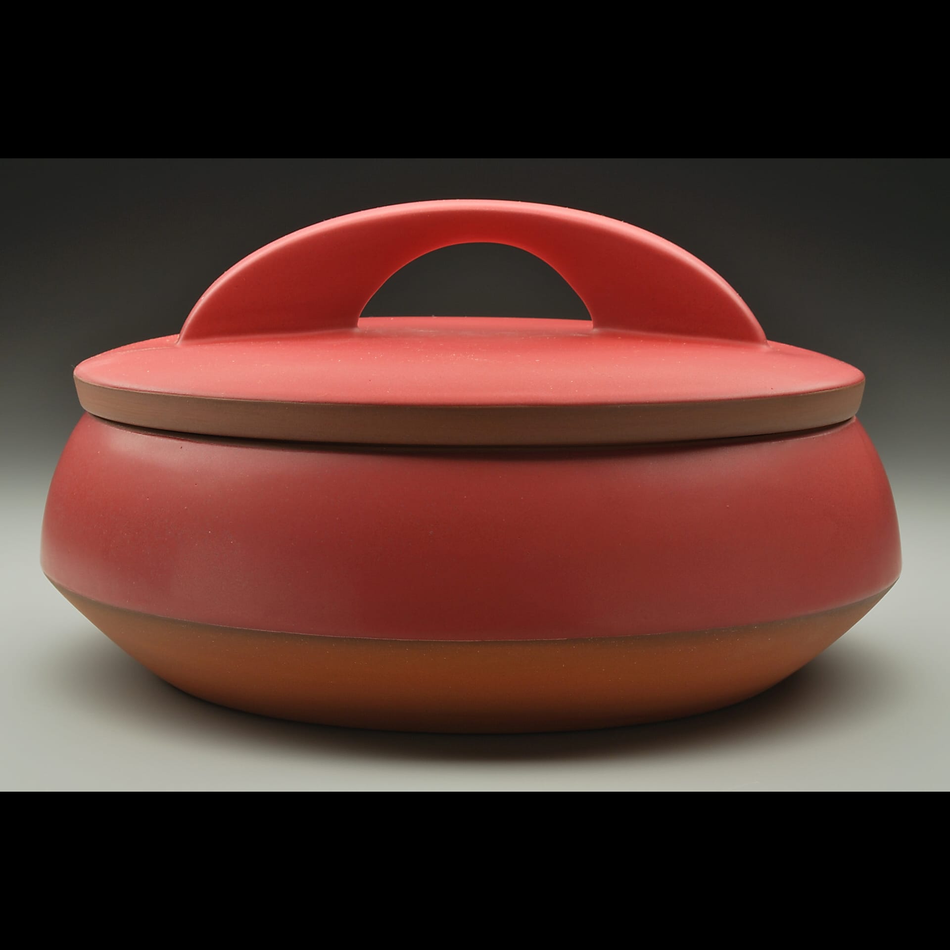 Red container with a lid.