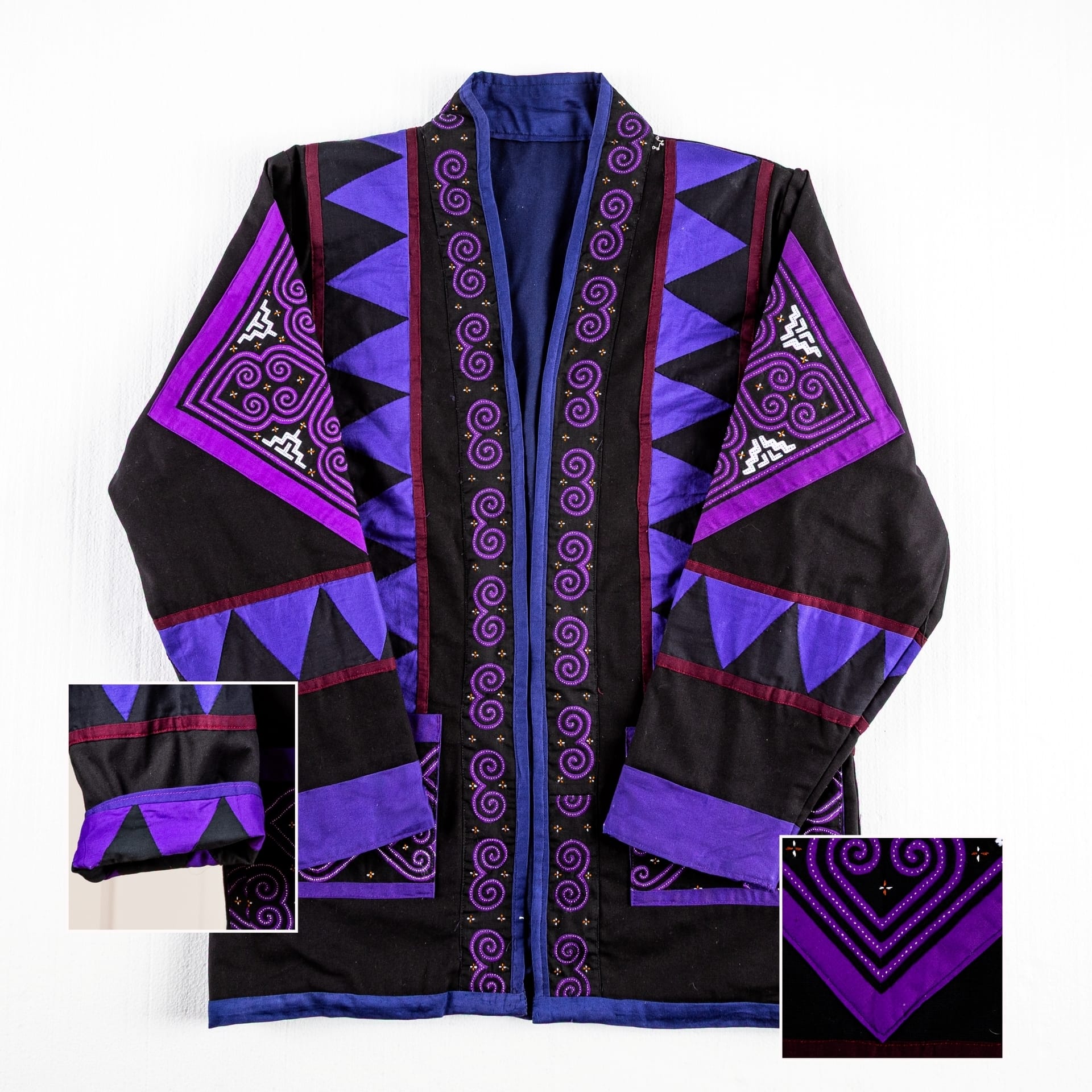 A purple and black jacket with Hmong textile patterns.