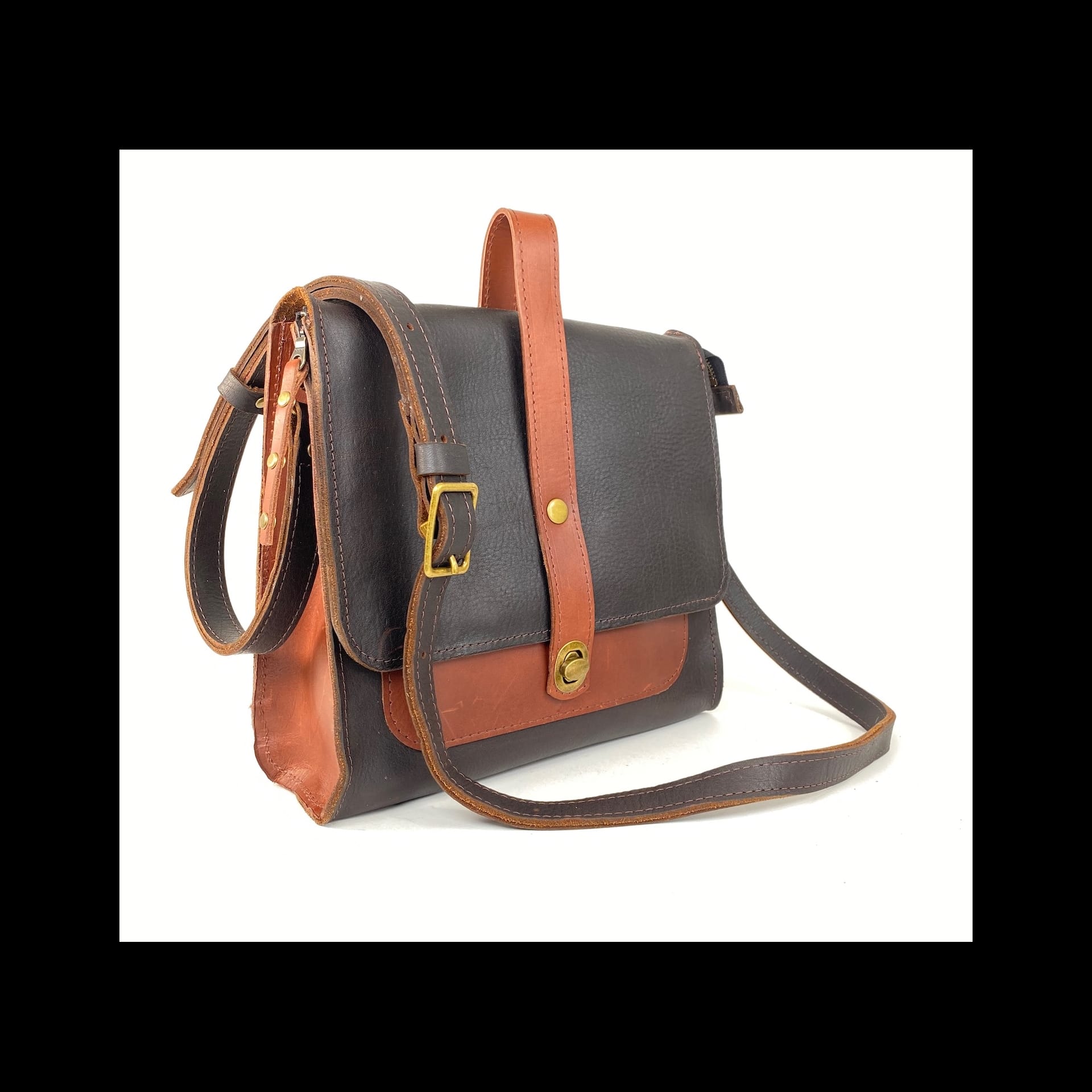A black and brown leather handbag.