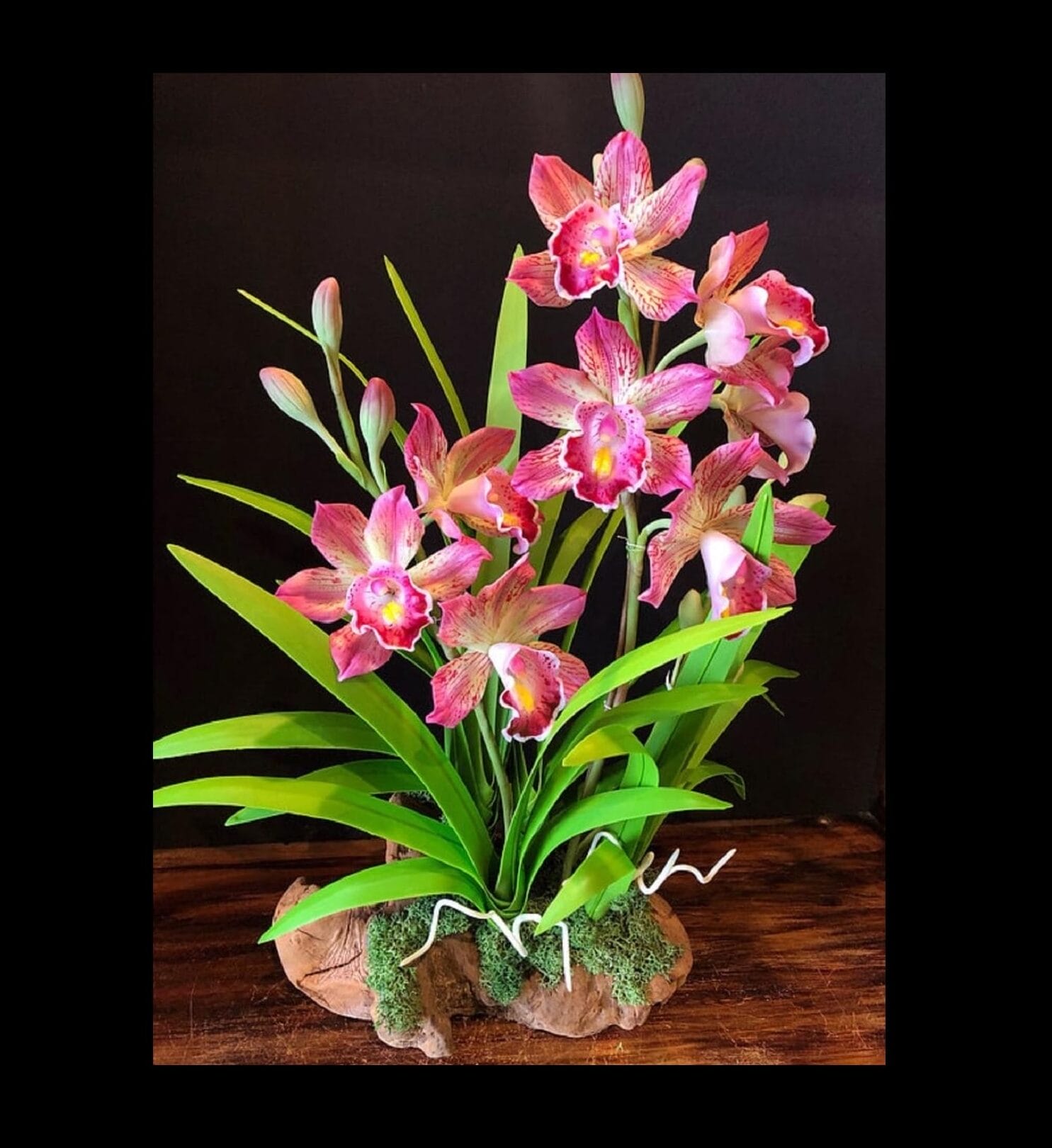 Pink flowers with bright green stems.