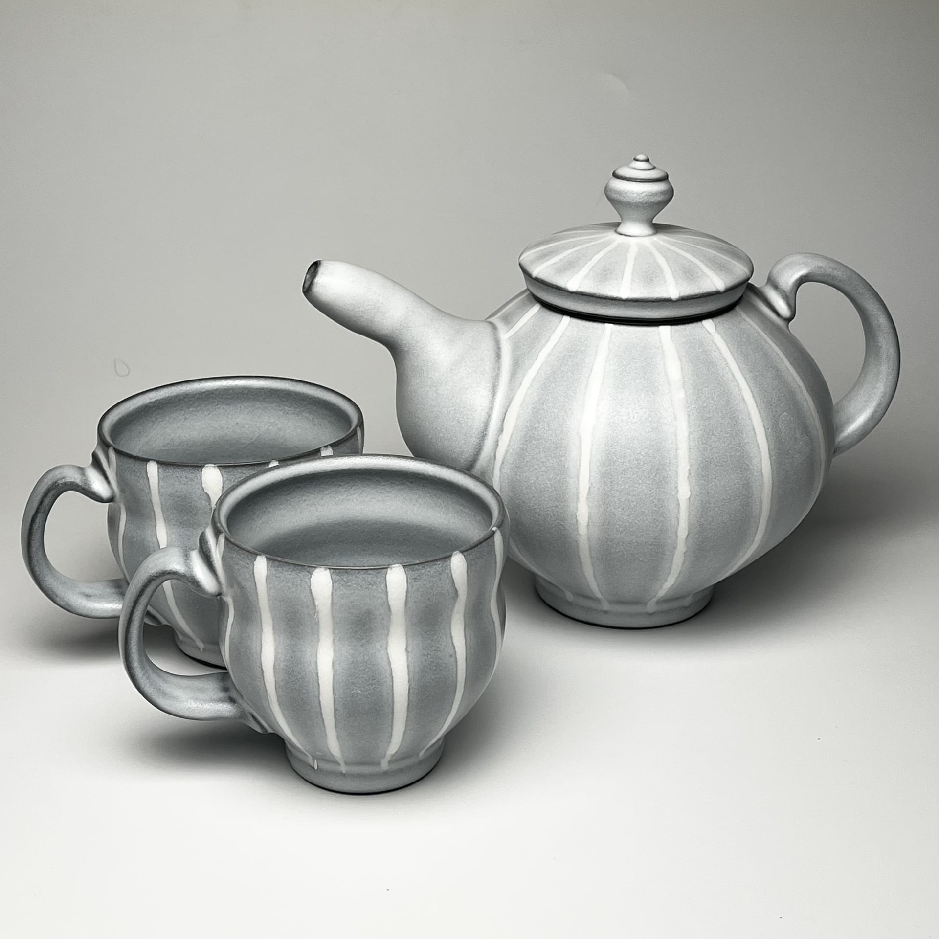 A grey striped tea set.