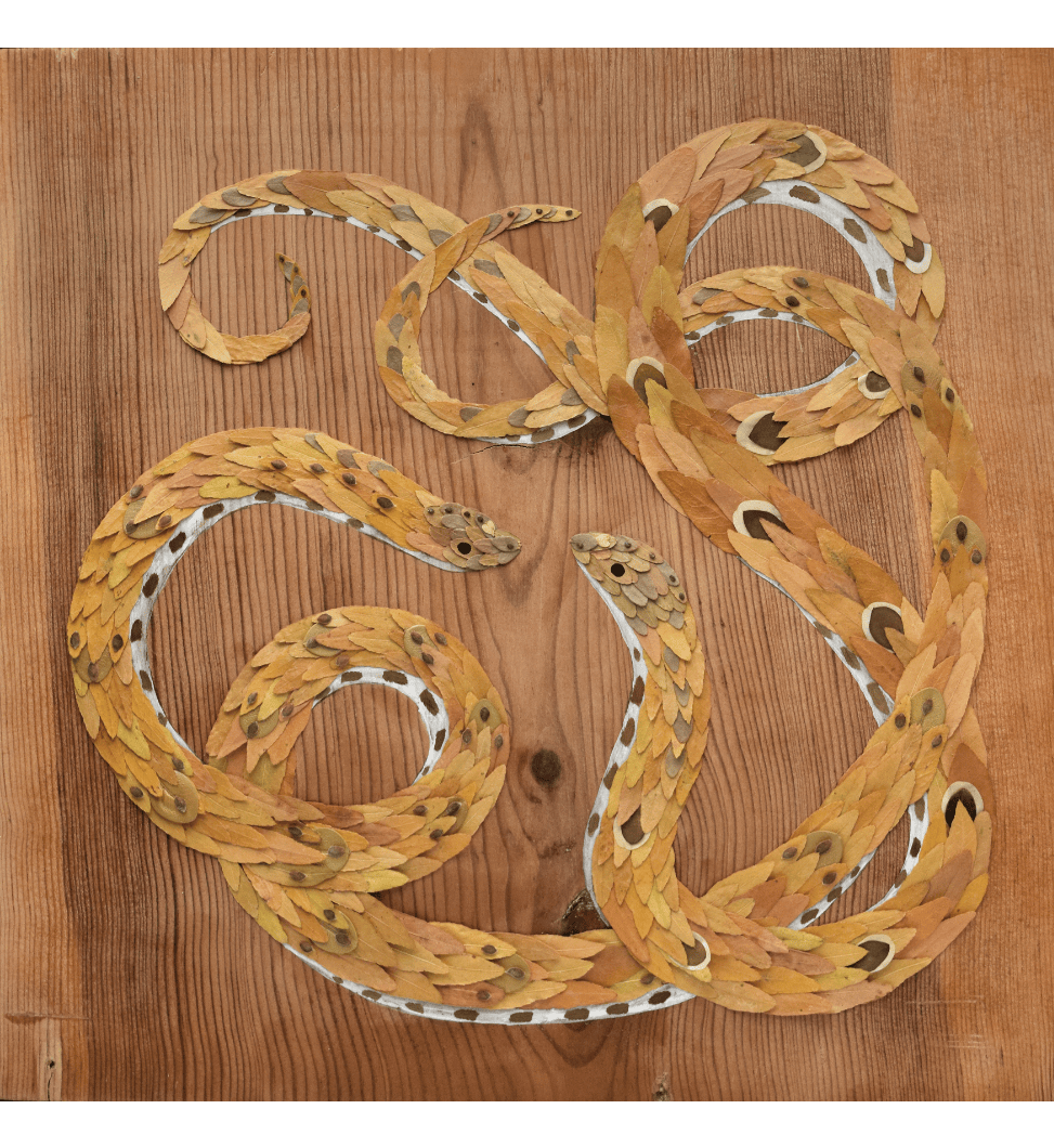 A wooden painting of a snake