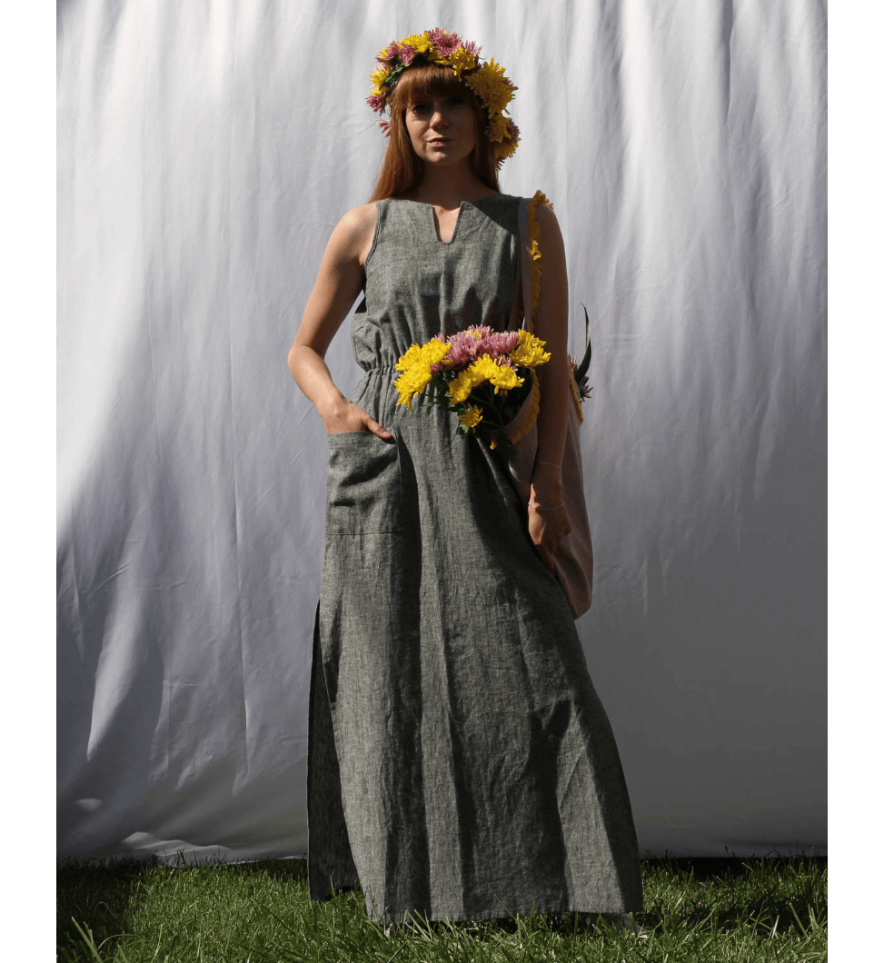 a figure wearing a grey dress