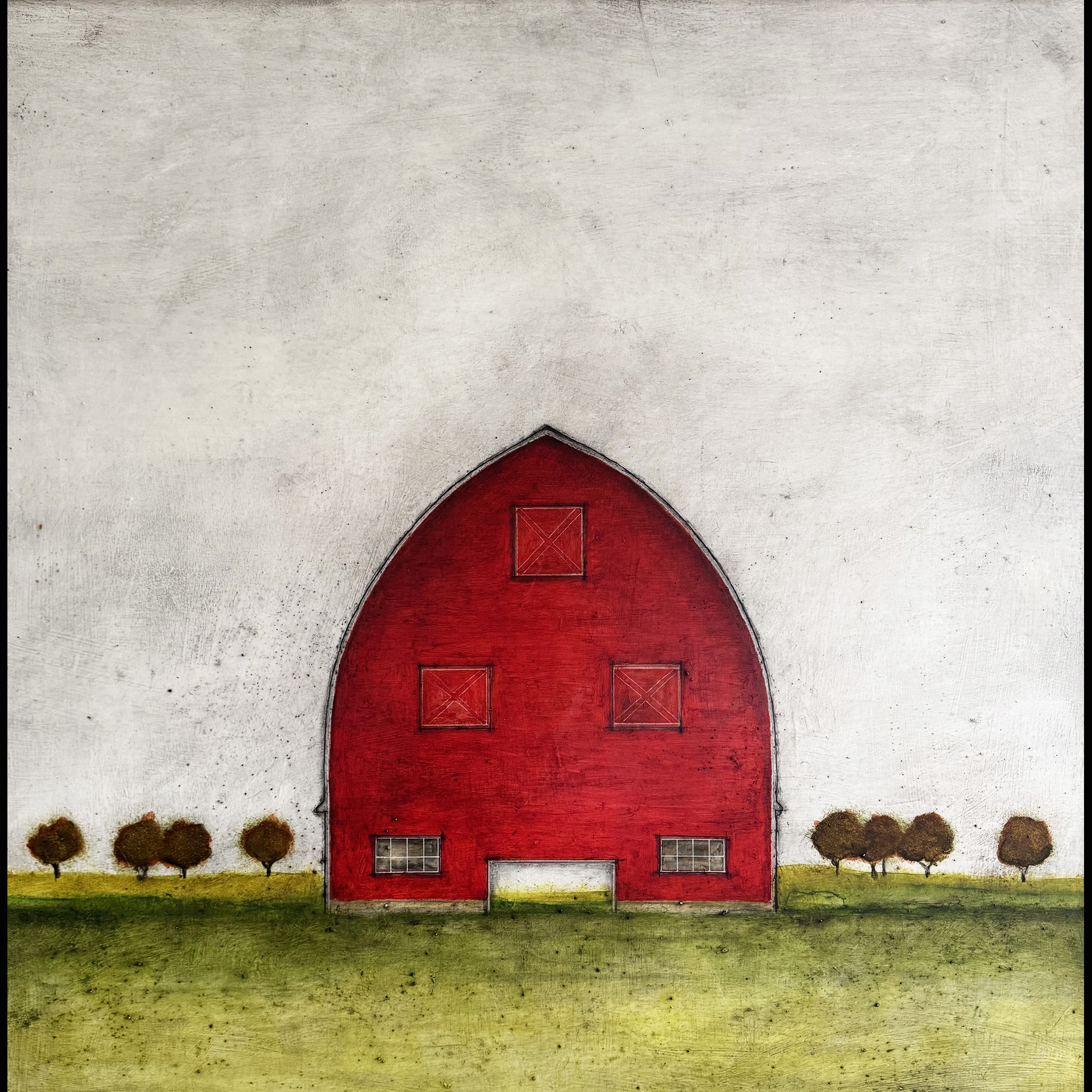 A red barn in a green field.