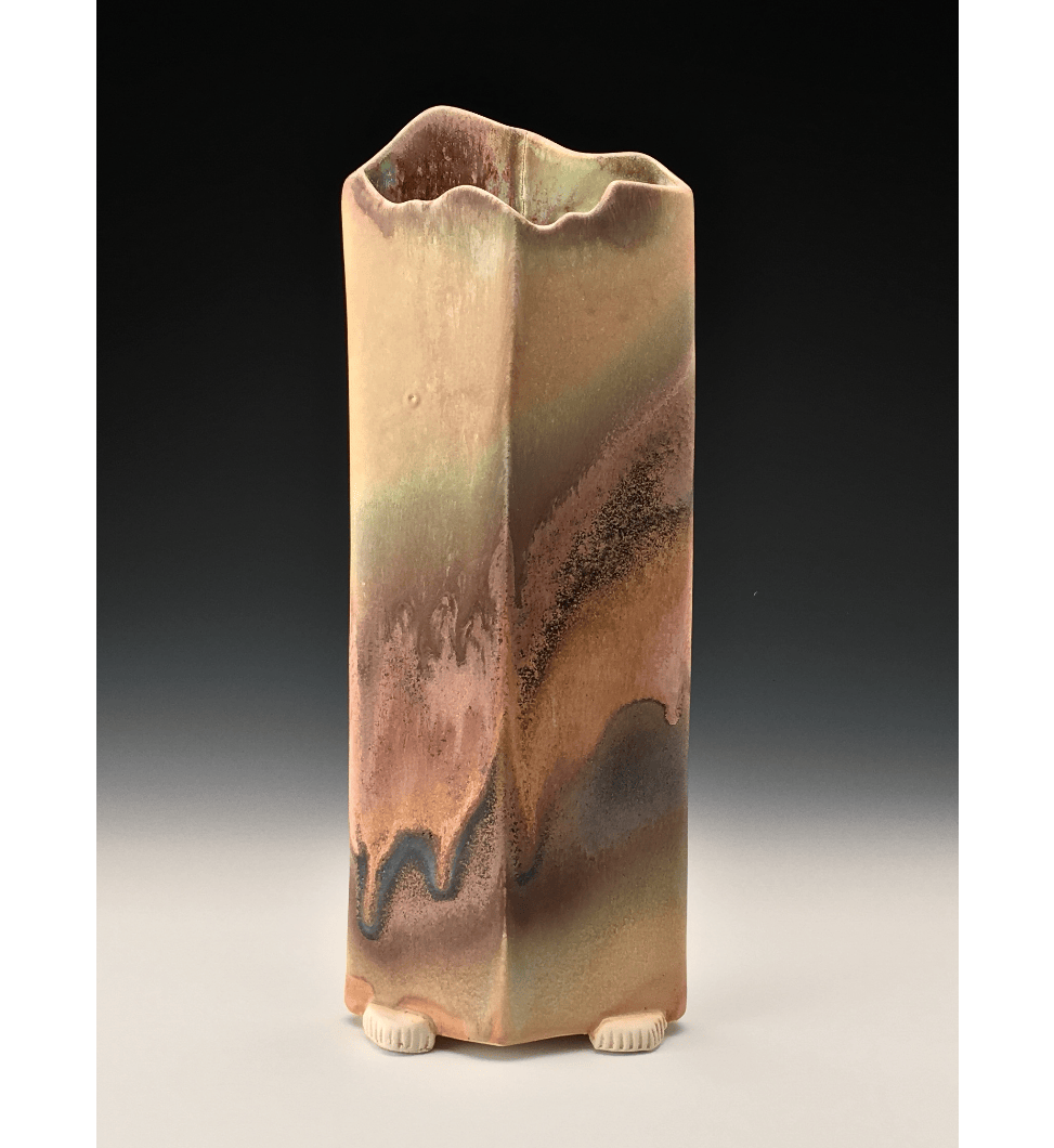 A brown rectilinear ceramic vessel