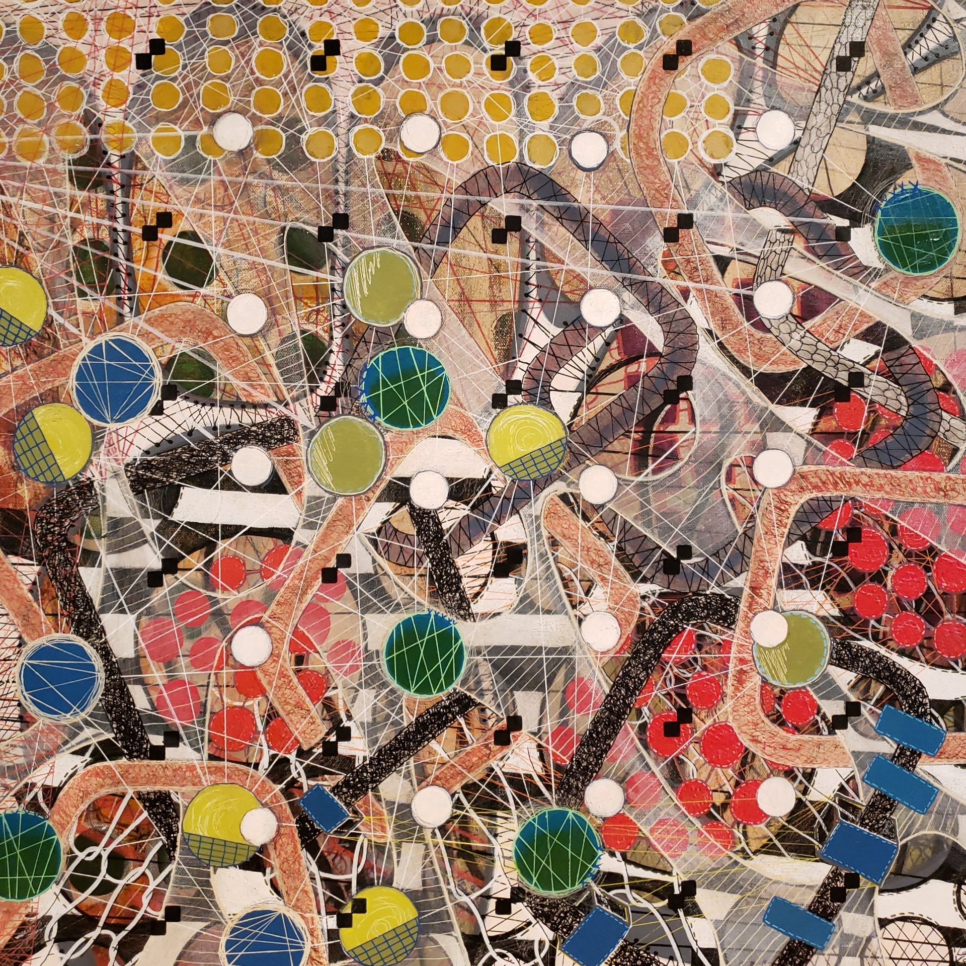 Many patterns and colors layered together to make an abstract painting.