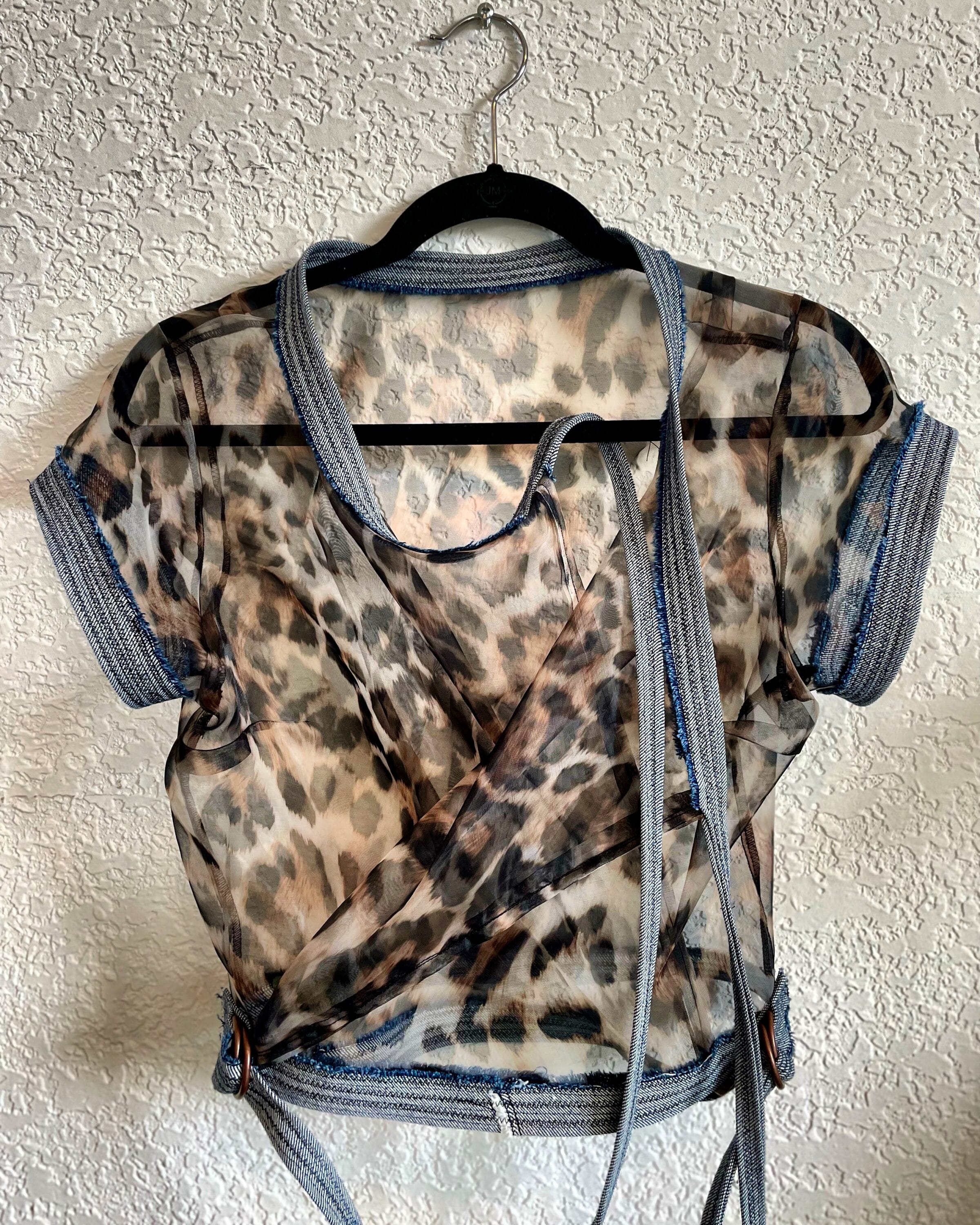 A sheer cheetah print shirt.