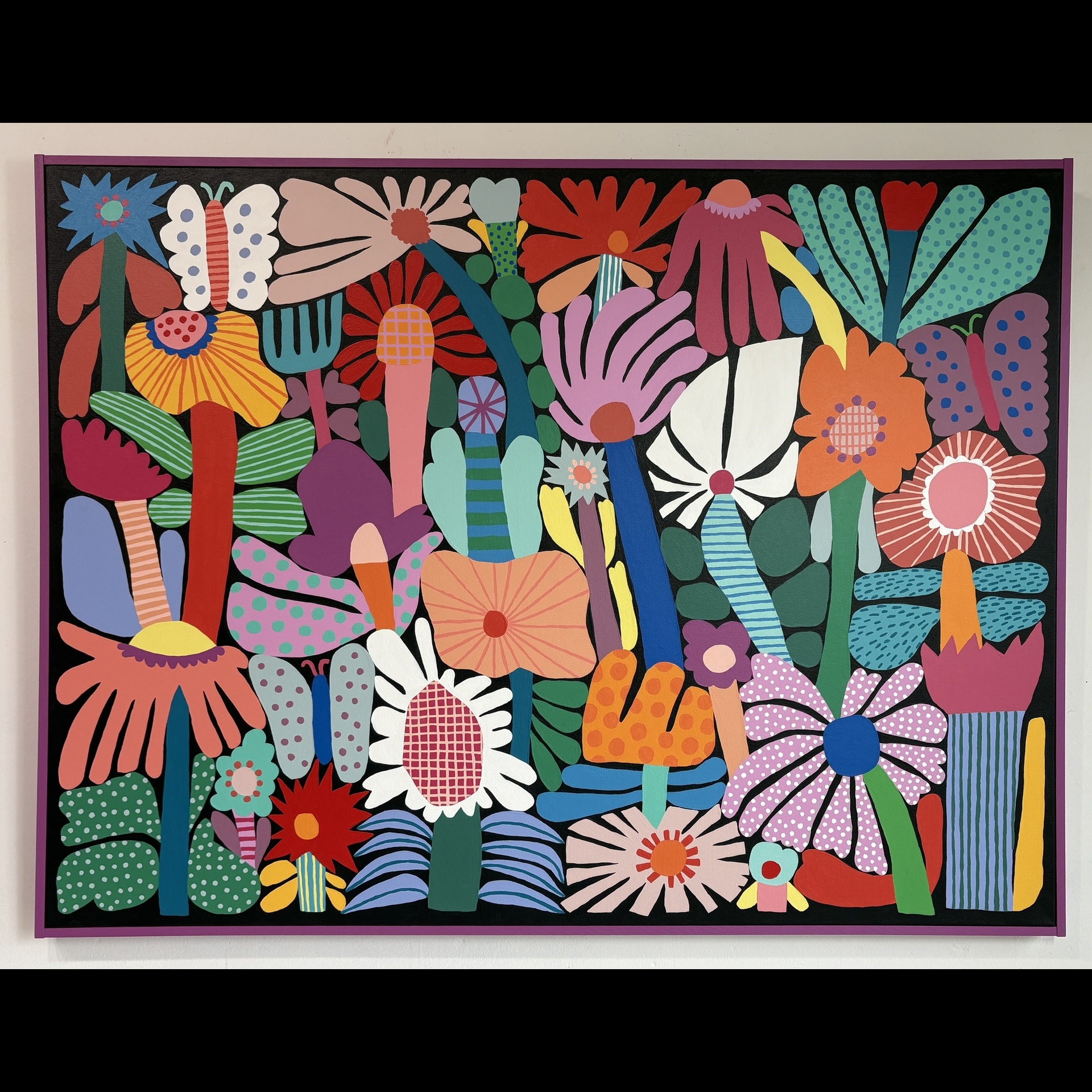 A colorful painting of abstract flowers and plants.