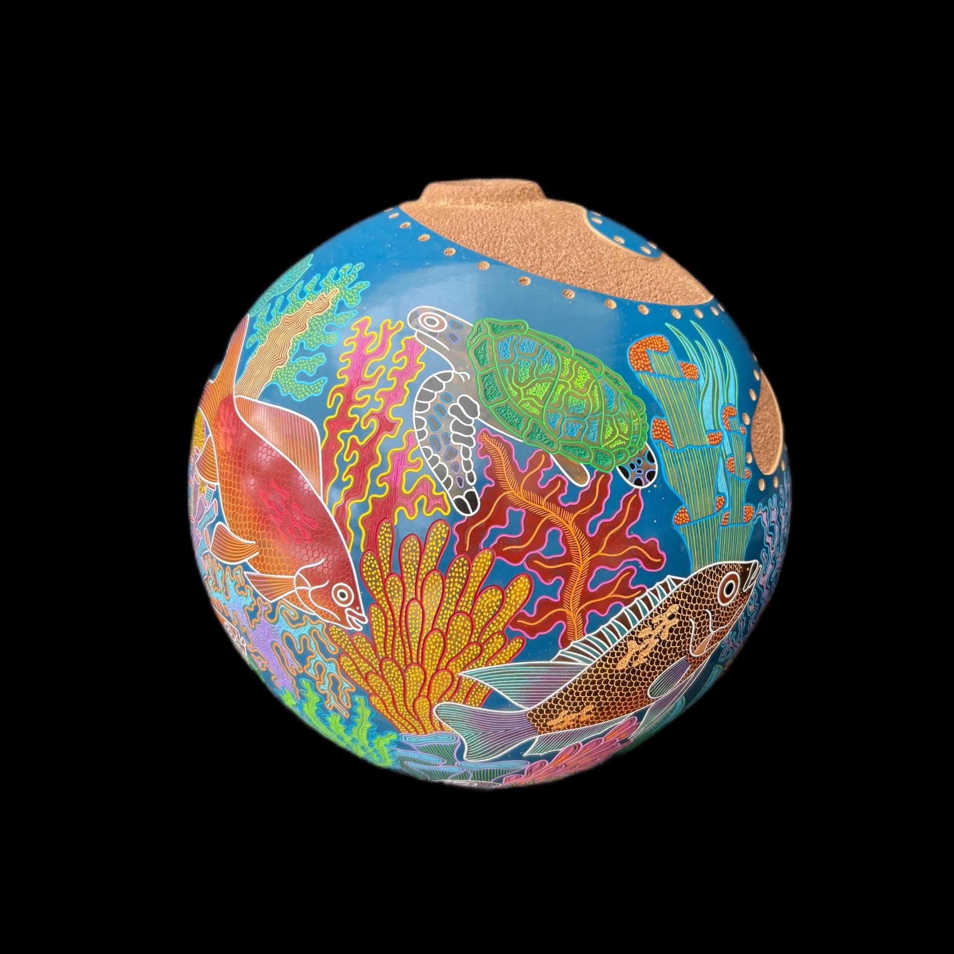 A sculpted sphere with aquatic life painted on it.
