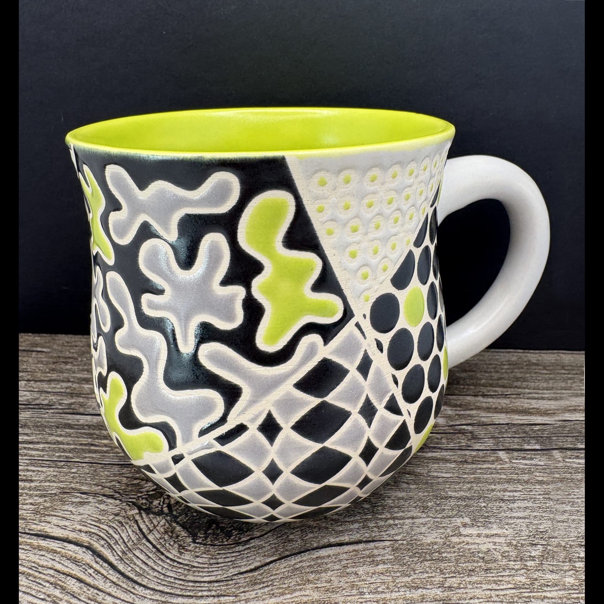 A colorful and pattern filled mug.