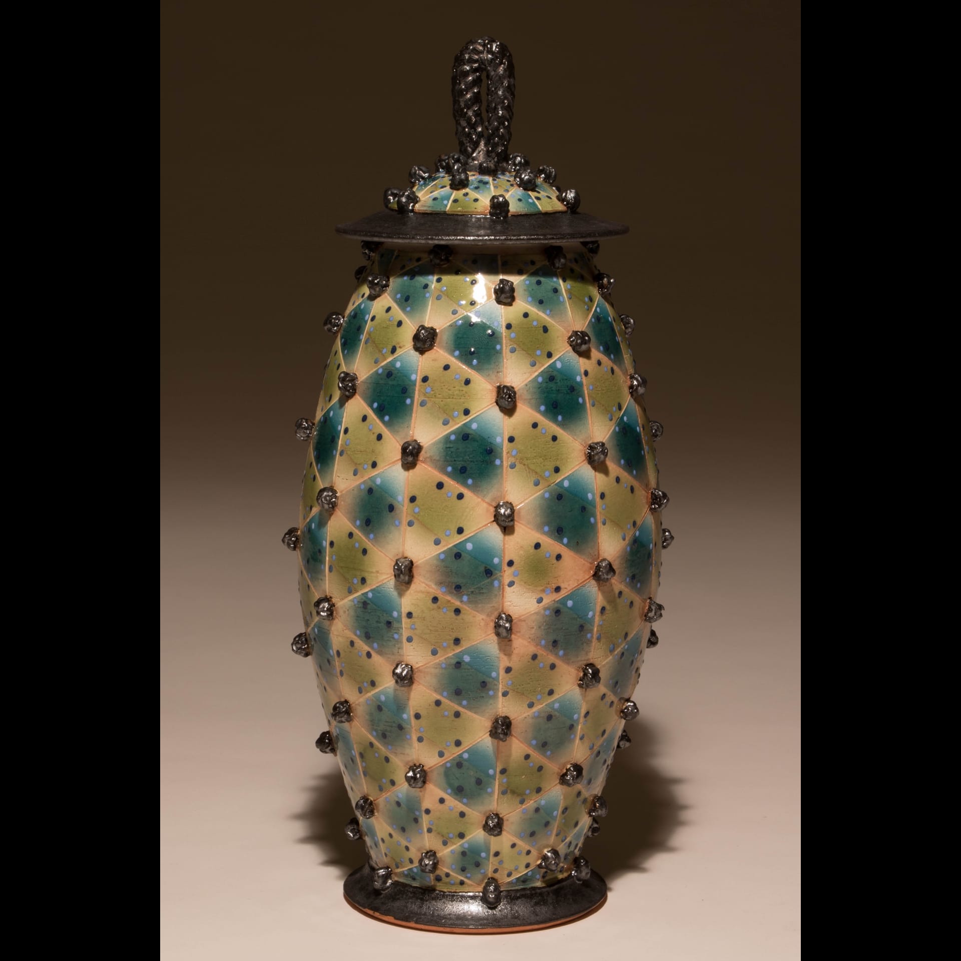 A colorful vase with blue and yellow pattern.