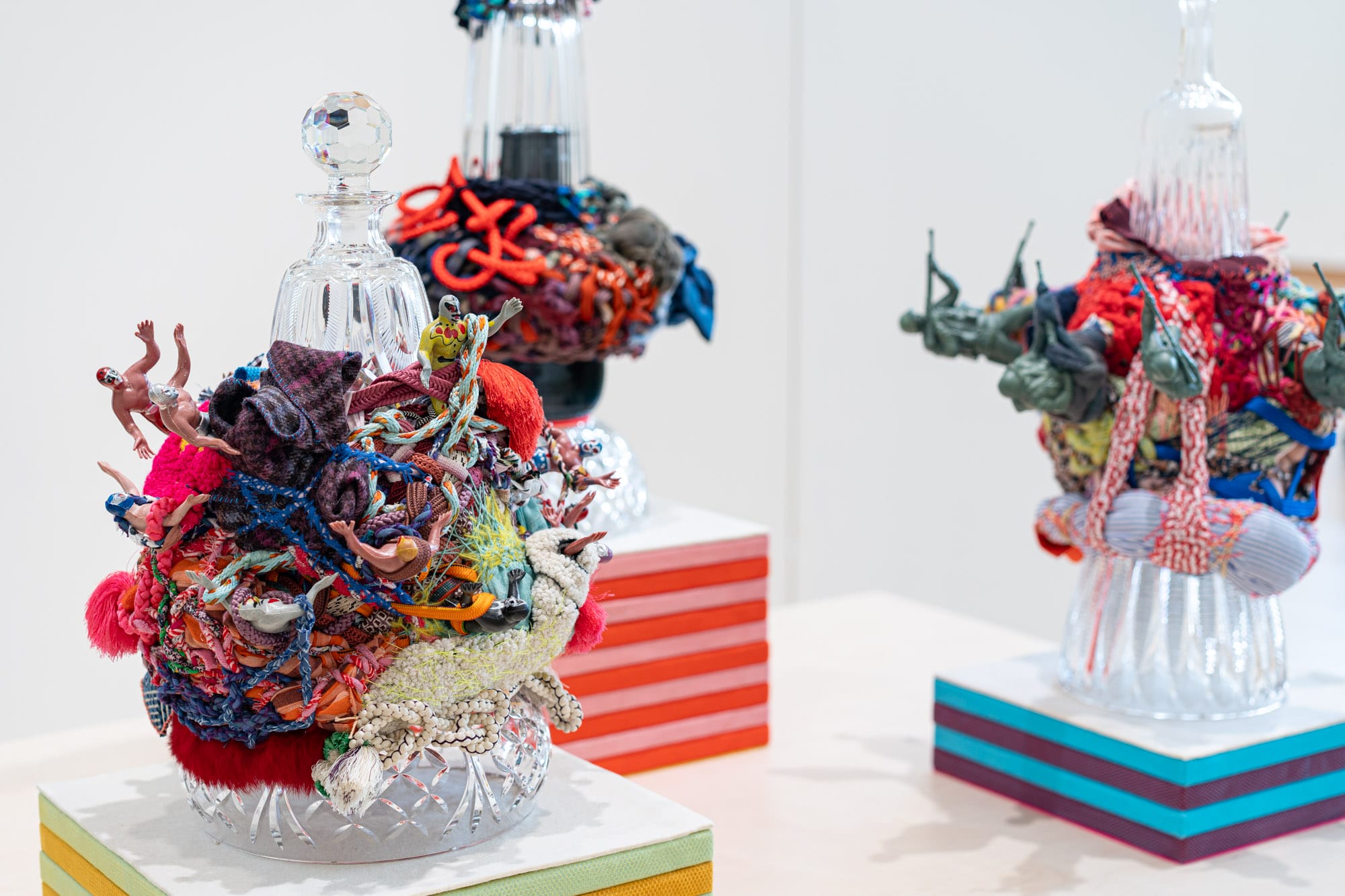 Numerous colorful and fiber filled art work.