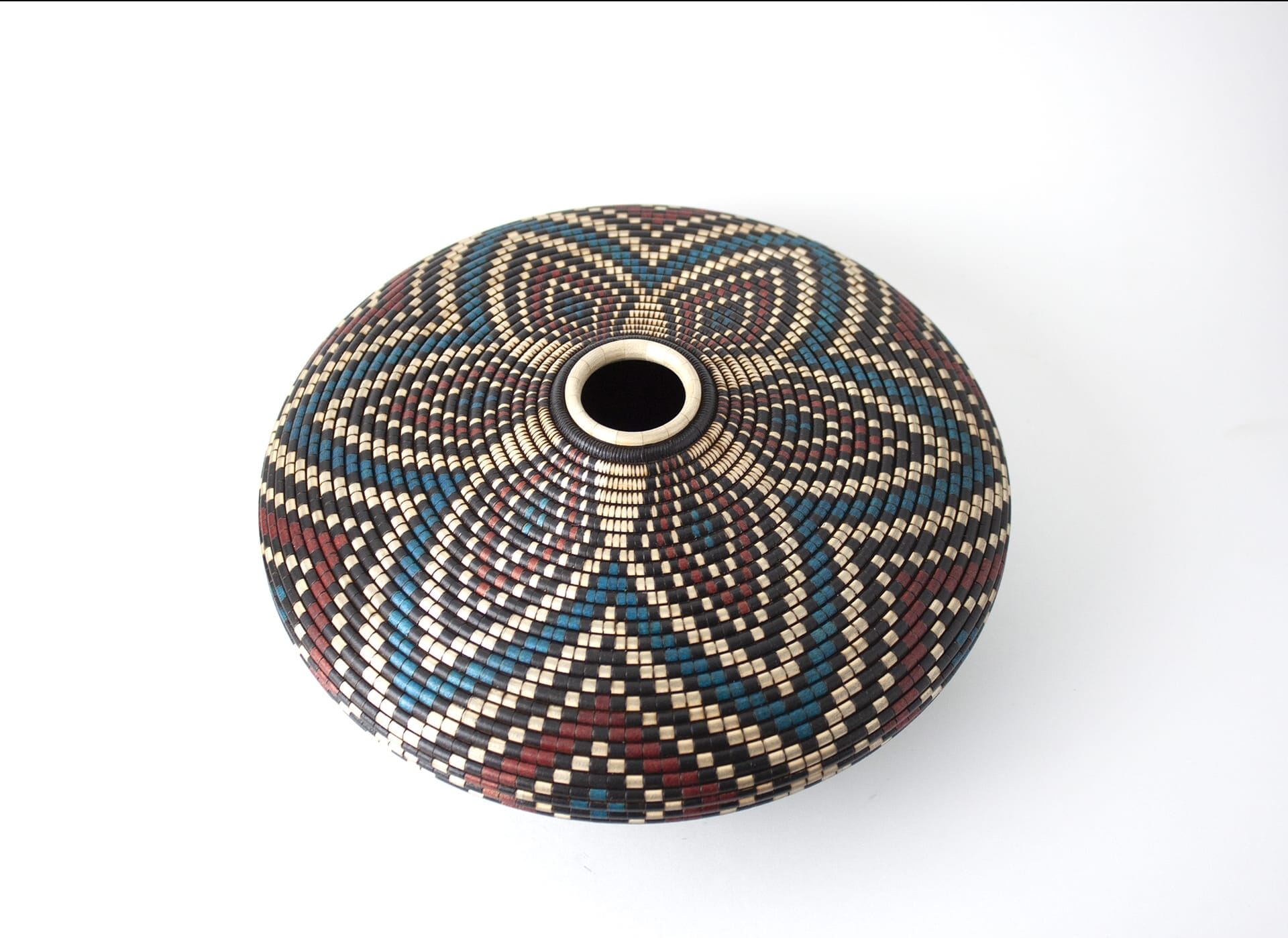 A decorative pot with a floral like shape.