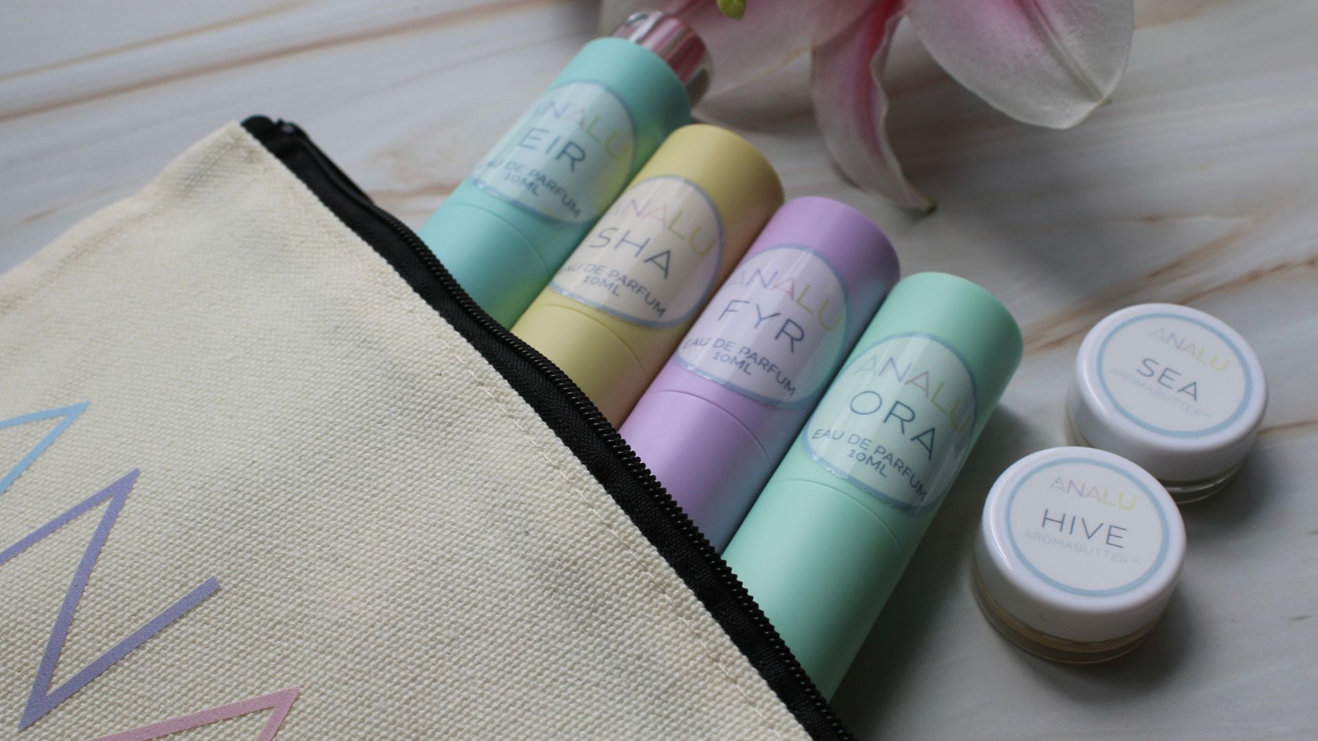Four pastel colored tubes
